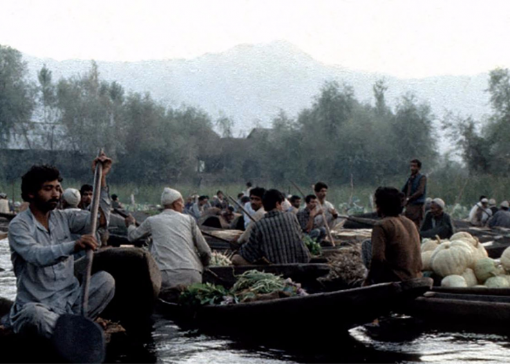 Men in boats, India 