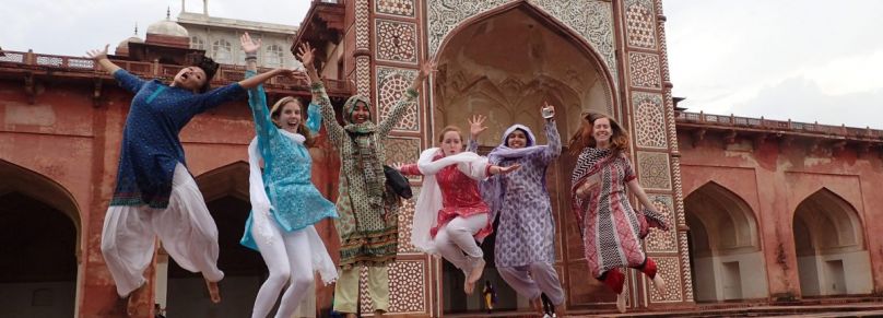 Group of students jumping in the air joyfully