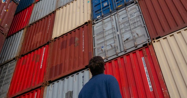 Stack of shipping containers at port for international trade