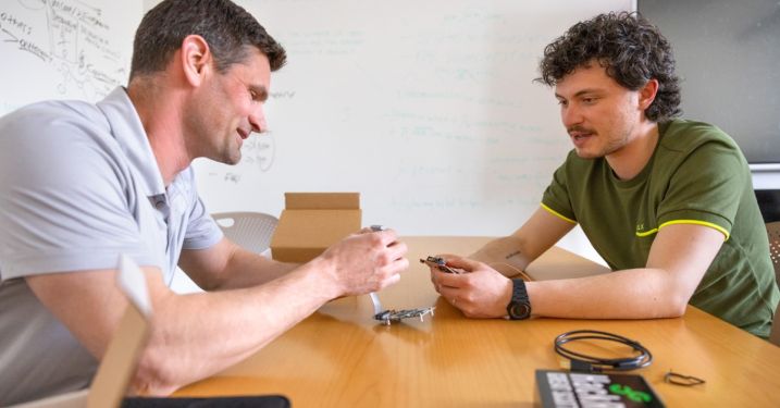 Army Lt. Col. Brett Reichert, left, interim director of the Semiconductor Supply Chain Security Hub, and Nicolò Boschetti, a doctoral candidate in the field of aerospace engineering, work with semiconductors in their offices in Martha Van Rensselaer Hall.
