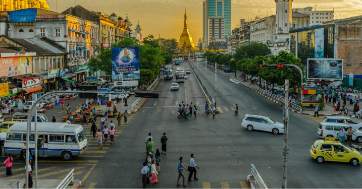 People walking on pedestrian lane in Yangon, in the evening