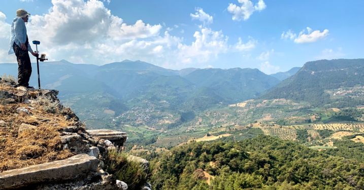 Benjamin Anderson, associate professor of history of art and visual studies, surveys the walls on the acropolis in Sardis, Turkey.