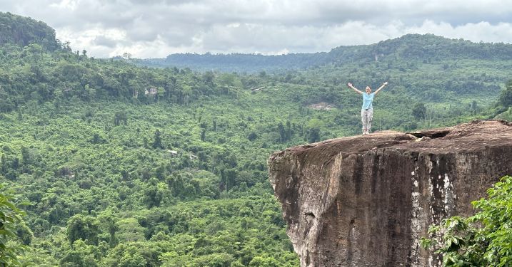 Emma Alexander stands at the top of Phnom Kulen Mountain.