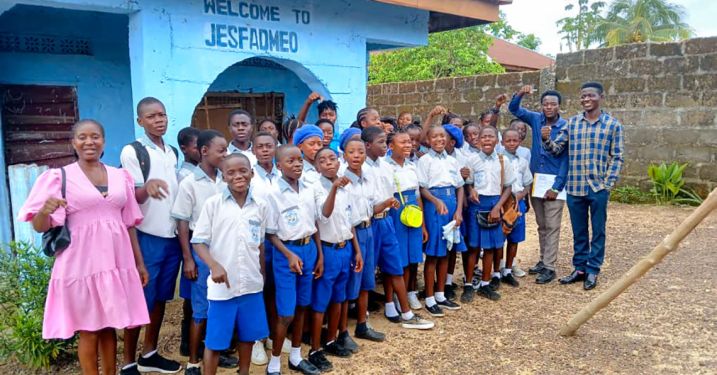 Students from Jasfameo Junior Secondary School in Bo City, Sierra Leone, a participant in the Youth Climate Science Lab and Collaboration Hub project, with Bashiru Koroma, president and CEO of Keep Africa Beautiful Sierra Leone (far right); teacher Emmanuel Mannah; and Alberta Samuels, project coordinator for the hub (far left).