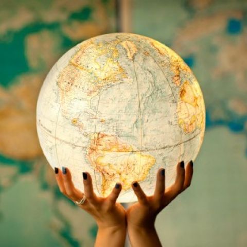 Globe being held in hands