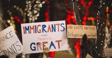 Sign at rally reads 'Immigrants Make America Great'